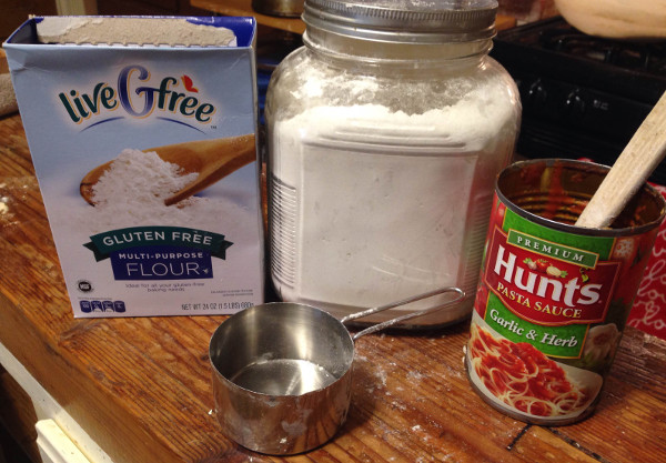 I used "Live G Free" flour from Aldi. which was on clearance for $1.99 a box. One box makes two pizzas. 