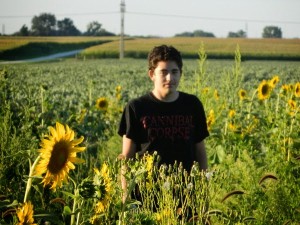 Connor tiptoeing through the sunflower field. 